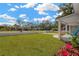 Well-manicured front yard and the home's exterior at 1910 E Chelsea St, Tampa, FL 33610