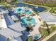 Resort-style community pool featuring a splash pad and various water features at 19573 Ship Wheel Way, Land O Lakes, FL 34638