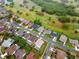 An aerial view shows the property's location within a residential neighborhood with mature trees and community amenities nearby at 2015 Golf Manor Blvd, Valrico, FL 33596