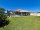 This home features a beautiful backyard with a screened in pool area for outdoor entertaining and relaxation at 2015 Golf Manor Blvd, Valrico, FL 33596