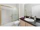 Bathroom with tub and shower, vanity and granite counters at 2015 Golf Manor Blvd, Valrico, FL 33596