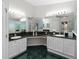 This bathroom features granite counters with dual sinks, vanity area, and a large mirror at 2015 Golf Manor Blvd, Valrico, FL 33596