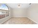 Airy room with a large window, neutral walls, tiled floor, and lots of natural light at 2015 Golf Manor Blvd, Valrico, FL 33596