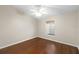 Bright bedroom featuring wood floors, a ceiling fan, and a window at 2015 Golf Manor Blvd, Valrico, FL 33596