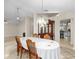 Open-concept dining area with stylish lighting and seamless access to other living spaces at 2015 Golf Manor Blvd, Valrico, FL 33596