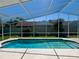 Sparkling screened-in swimming pool with a clear blue water, perfect for relaxation at 2015 Golf Manor Blvd, Valrico, FL 33596