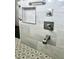 Close up of the shower fixtures in the renovated bathroom at 2015 Golf Manor Blvd, Valrico, FL 33596