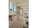 This renovated shower includes a fold down seat, toiletry storage and is surrounded by tile at 2015 Golf Manor Blvd, Valrico, FL 33596