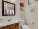 Cozy bathroom featuring wooden vanity, modern sink, and decorative accents for a touch of elegance at 210 Fernwood Cir # 210, Seminole, FL 33777