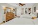 Bright bedroom featuring two beds, a dresser, and convenient access to a washer and dryer at 210 Fernwood Cir # 210, Seminole, FL 33777