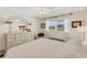 Sunlit bedroom with a view, ceiling fan, and stylish decor for comfortable and relaxed living at 210 Fernwood Cir # 210, Seminole, FL 33777
