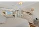 Bright bedroom with a ceiling fan, large mirror closet, and ample storage space at 210 Fernwood Cir # 210, Seminole, FL 33777