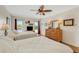 Cozy bedroom featuring two beds, natural light from windows, and a traditional dresser at 210 Fernwood Cir # 210, Seminole, FL 33777