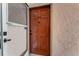 Entry door to unit 210 with screen door at 210 Fernwood Cir # 210, Seminole, FL 33777