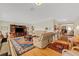 Open-concept living room with hardwood floors, a piano, and comfortable seating at 210 Fernwood Cir # 210, Seminole, FL 33777