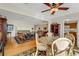 Wide-angle view of the living room with a dining area and kitchen at 210 Fernwood Cir # 210, Seminole, FL 33777