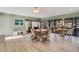 Spacious room featuring a dining table, comfortable seating, and views of the pool area at 210 Fernwood Cir # 210, Seminole, FL 33777