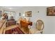 Inviting living room with hardwood floors, vintage furnishings, and ample natural light at 210 Fernwood Cir # 210, Seminole, FL 33777