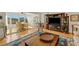 Open-concept living room with hardwood floors and a large window providing plenty of natural light at 210 Fernwood Cir # 210, Seminole, FL 33777