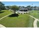 Bright outdoor community pool featuring ample seating and lush lawn at 210 Fernwood Cir # 210, Seminole, FL 33777
