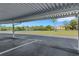 A water view beyond assigned carport parking at 210 Fernwood Cir # 210, Seminole, FL 33777