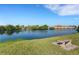 Beautiful water view from bench with manicured lawn at 210 Fernwood Cir # 210, Seminole, FL 33777