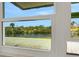 Scenic view of the lake and lush greenery from the window at 210 Fernwood Cir # 210, Seminole, FL 33777