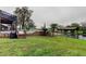Backyard with pool, lake access, boat dock, and patio at 22819 Southshore Dr, Land O Lakes, FL 34639