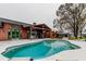 Spacious backyard with a pool, covered patio, and ample seating, perfect for outdoor entertaining at 22819 Southshore Dr, Land O Lakes, FL 34639