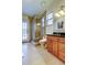 Bathroom featuring a tiled shower, vanity, and granite countertops at 22819 Southshore Dr, Land O Lakes, FL 34639