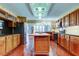 Spacious kitchen with custom cabinets, tile floors, and stainless steel appliances at 22819 Southshore Dr, Land O Lakes, FL 34639