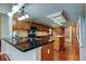 Traditional kitchen with wood cabinets, granite counters, and brick flooring at 22819 Southshore Dr, Land O Lakes, FL 34639