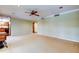 Open living room featuring neutral-toned walls and carpeting at 22819 Southshore Dr, Land O Lakes, FL 34639