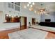 A spacious great room with an open floor plan and hardwood floors flows from the kitchen and Gathering room at 22819 Southshore Dr, Land O Lakes, FL 34639