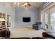 Inviting living area with vaulted ceiling, TV, carpeted floor, and French doors at 22819 Southshore Dr, Land O Lakes, FL 34639