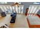 Living room with high ceilings, ceiling fan, and glass doors to outdoor patio at 22819 Southshore Dr, Land O Lakes, FL 34639