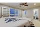 The main bedroom has a ceiling fan, french doors to a patio, and access to the main bathroom at 22819 Southshore Dr, Land O Lakes, FL 34639