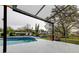 Inviting screened-in pool overlooking a picturesque backyard at 22819 Southshore Dr, Land O Lakes, FL 34639