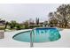 A backyard pool with an elegant design and a beautiful view of the surrounding waterfront at 22819 Southshore Dr, Land O Lakes, FL 34639