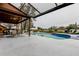 Inviting screened-in pool with outdoor dining and lounge areas at 22819 Southshore Dr, Land O Lakes, FL 34639