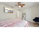 Comfortable bedroom featuring a ceiling fan and a television at 2515 Sherman Oak Dr, North Port, FL 34289