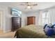 Bedroom featuring neutral walls, ceiling fan, and ample natural light at 2515 Sherman Oak Dr, North Port, FL 34289