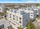 Community aerial view showcasing modern townhouses, clean white facades, and private rooftop terraces at 307 15Th N St, St Petersburg, FL 33705
