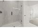 New glass shower featuring bright, white tile and modern fixtures at 307 15Th N St, St Petersburg, FL 33705