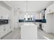 Spacious kitchen featuring white cabinets, stainless steel appliances, and a center island at 307 15Th N St, St Petersburg, FL 33705