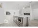 Kitchen island with a built-in microwave oven and pendant lighting at 307 15Th N St, St Petersburg, FL 33705