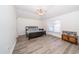 Inviting bedroom with bright window, ceiling fan, and modern flooring at 31826 Larkenheath Dr, Wesley Chapel, FL 33543