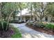 Inviting clubhouse entrance with a welcoming walkway and lush landscaping at 31826 Larkenheath Dr, Wesley Chapel, FL 33543