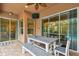 Inviting covered patio with ample seating and a view of the backyard oasis, perfect for outdoor dining at 3339 Diamond Falls Cir, Land O Lakes, FL 34638