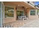 Exterior view of the patio with a dining area, creating an inviting space for outdoor meals and gatherings at 3339 Diamond Falls Cir, Land O Lakes, FL 34638